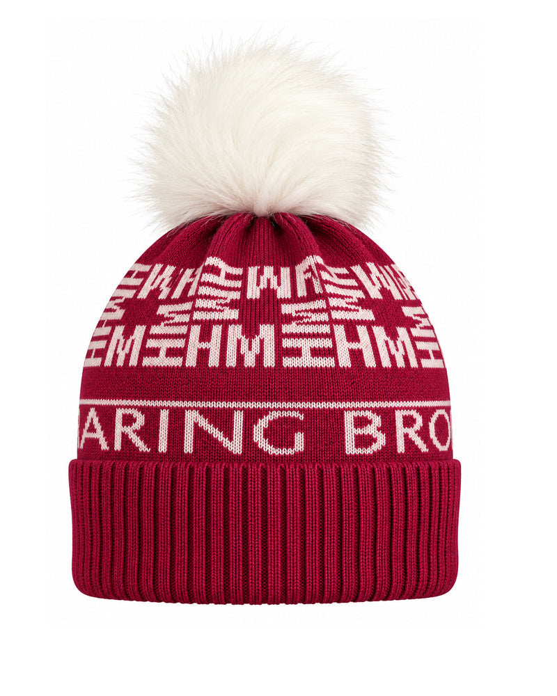 A burgundy knit beanie with a white faux fur pom-pom. The beanie features white knitted text reading 'EARING BRO' and 'MEHM' repeated in a geometric pattern.