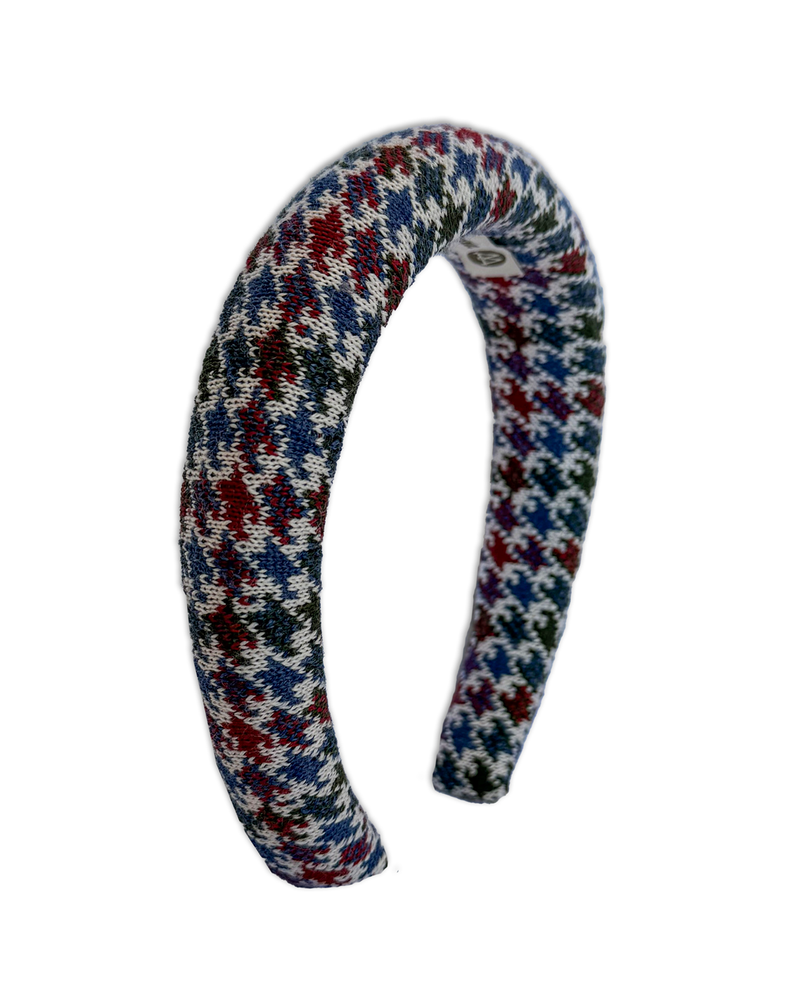 A curved knit headband featuring a multicolor houndstooth pattern with red, blue, green, and white yarn, shown against a plain white background.
